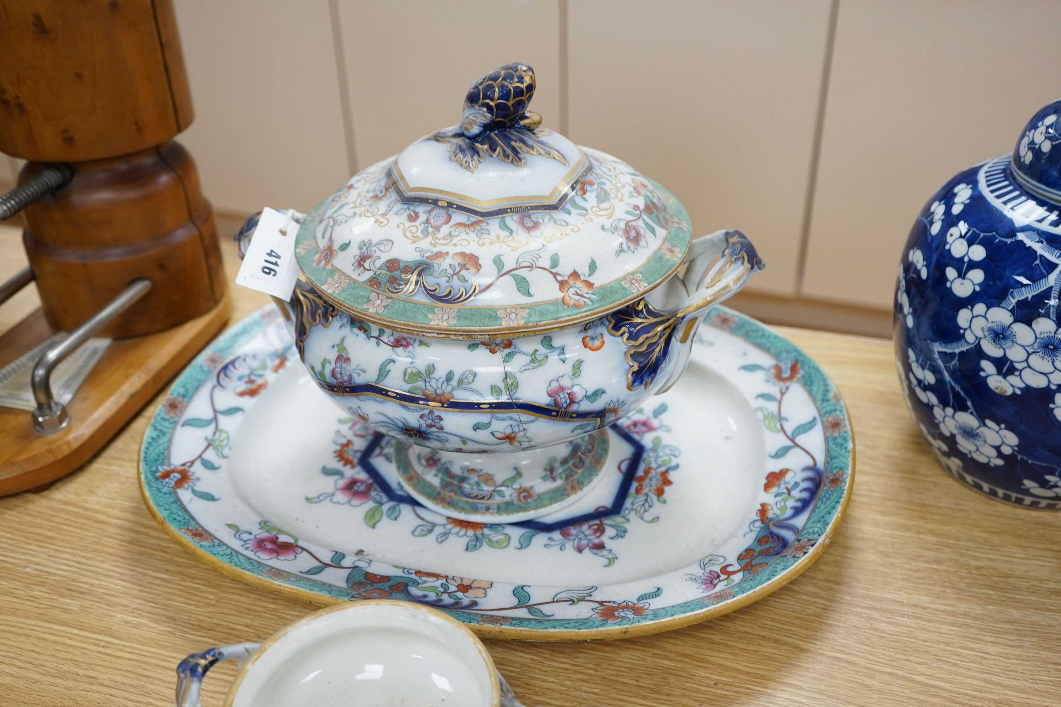A mid 19th century Staffordshire pottery lidded soup tureen and cover (base cracked), a large meat dish and a sauce tureen (lacking lid) (3)